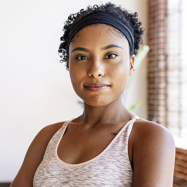 Trainer and her students in a yoga class